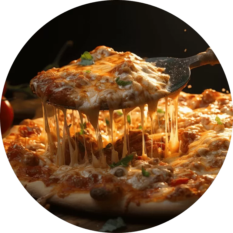 A pizza being slice