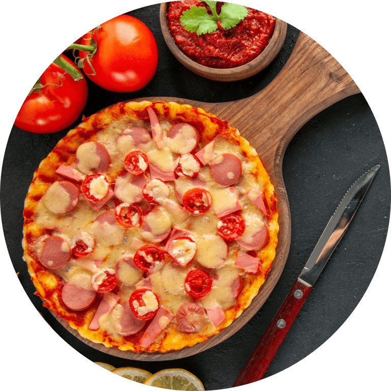 Pizza with tomatoes and cheese on a wooden board